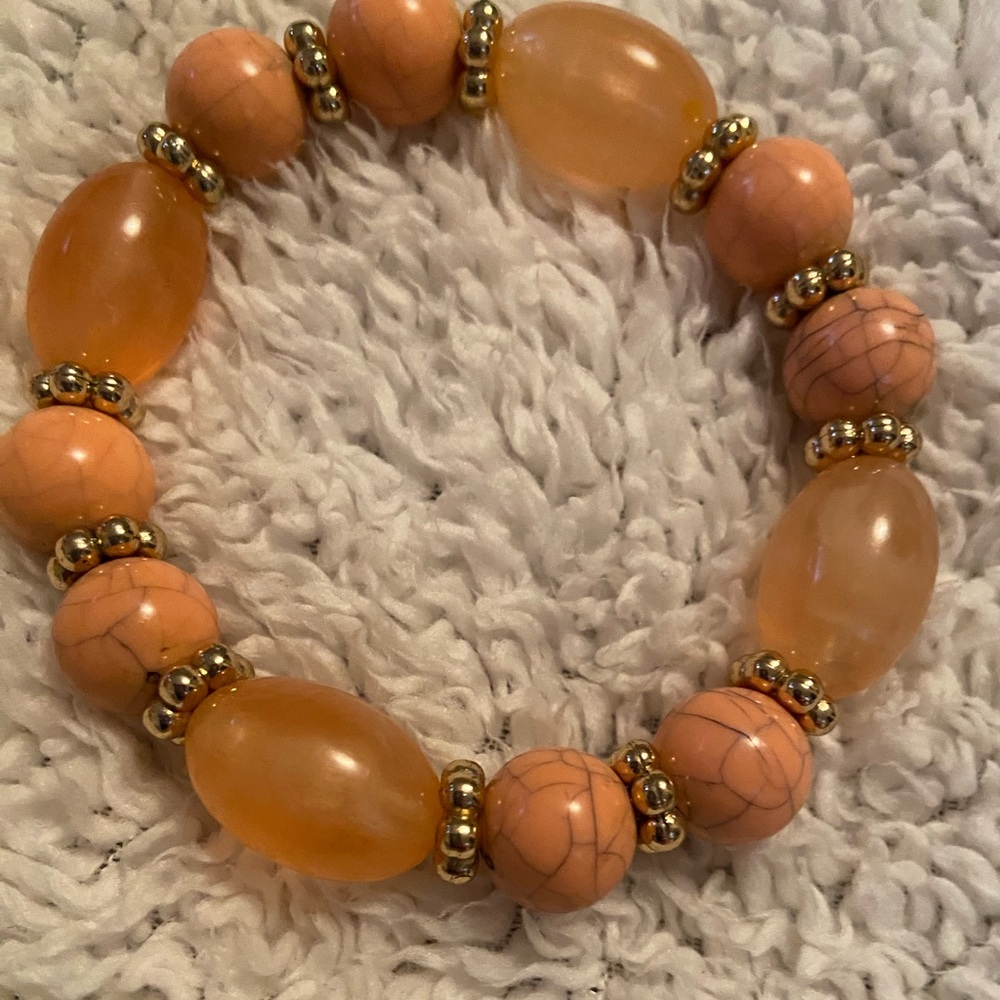Avon peach and gold bracelet.